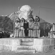 Cover image of Peter Ear, unknown, winter carnival queen, possibly Tom Kaquitts (Sûga Wakâ) (Dog God) and John Hunter (Îrhe Wapta), Stoney Nakoda at Banff Winter Carnival